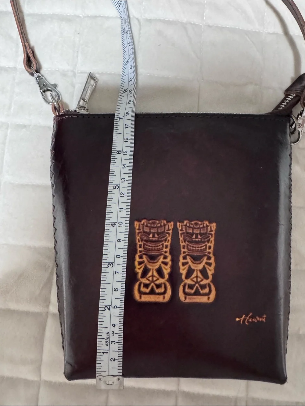 Dark Brown Leather Crossbody Bag with Embossed Tiki Design from Hawaii
